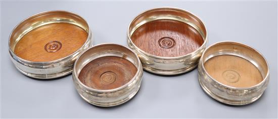 Two pairs of modern silver wine coasters, largest 13.2cm.